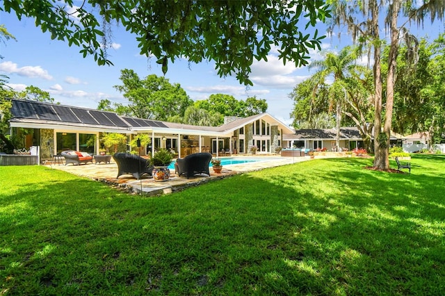 16205 Sentry Woods Ct, Odessa, FL 33556 - back of property featuring a patio area, a yard, an outdoor pool, and outdoor lounge area