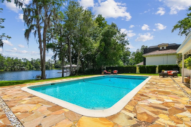 16205 Sentry Woods Ct, Odessa, FL 33556 - swimming pool with a patio area and a water view