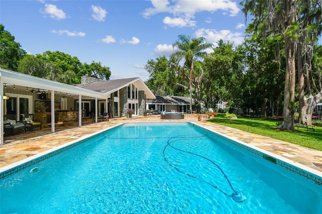 16205 Sentry Woods Ct, Odessa, FL 33556 - swimming pool with a patio area, ceiling fan, an outdoor hangout area, and a lawn