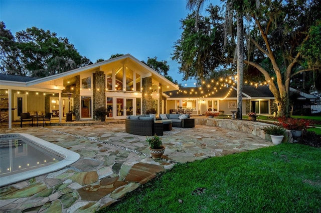 16205 Sentry Woods Ct, Odessa, FL 33556 - back of house with outdoor lounge area, french doors, and a patio