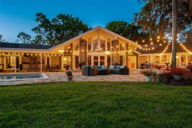 16205 Sentry Woods Ct, Odessa, FL 33556 - rear view of house with outdoor lounge area, a lawn, an outdoor pool, and a patio area