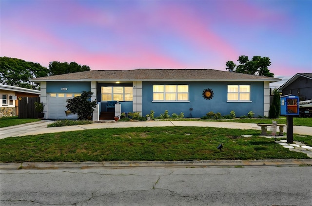 4211 28th Ave N, Saint Petersburg, FL 33713 - ranch-style home featuring a lawn, stucco siding, a garage, and concrete driveway