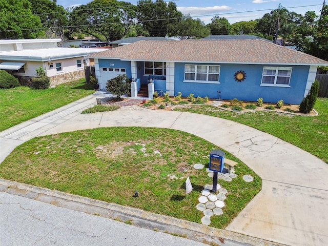 4211 28th Ave N, Saint Petersburg, FL 33713 - single story home with an attached garage, stucco siding, driveway, a front yard, and roof with shingles