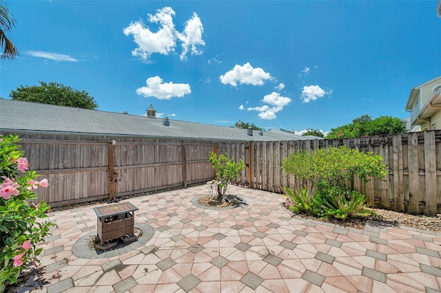 6400 46th Ave N Unit 61, Kenneth City, FL 33709 - fenced backyard with a patio area