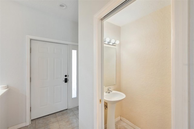 6400 46th Ave N Unit 61, Kenneth City, FL 33709 - entryway with baseboards and light tile patterned floors