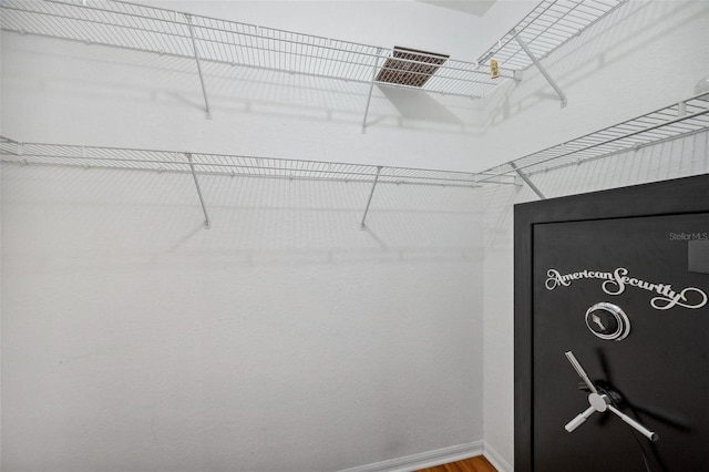 6400 46th Ave N Unit 61, Kenneth City, FL 33709 - walk in closet featuring wood finished floors