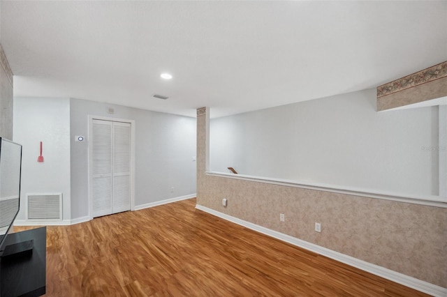 6400 46th Ave N Unit 61, Kenneth City, FL 33709 - below grade area with baseboards and wood finished floors