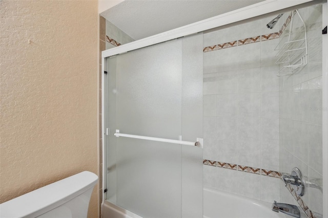 6400 46th Ave N Unit 61, Kenneth City, FL 33709 - full bath with a textured wall and combined bath / shower with glass door
