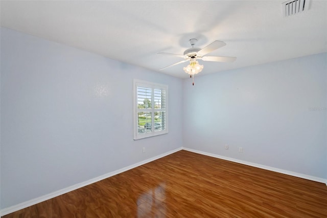 6400 46th Ave N Unit 61, Kenneth City, FL 33709 - unfurnished room with dark wood-style floors and a ceiling fan