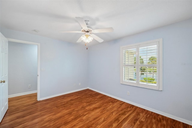 6400 46th Ave N Unit 61, Kenneth City, FL 33709 - spare room featuring wood finished floors and ceiling fan