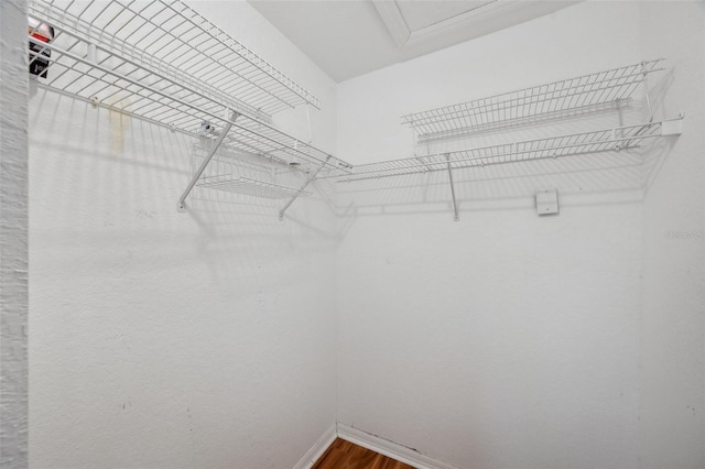 6400 46th Ave N Unit 61, Kenneth City, FL 33709 - spacious closet with dark wood-style flooring