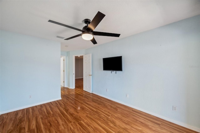 6400 46th Ave N Unit 61, Kenneth City, FL 33709 - empty room with wood finished floors and a ceiling fan