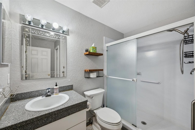 6400 46th Ave N Unit 61, Kenneth City, FL 33709 - full bathroom with a textured wall, vanity, and a stall shower