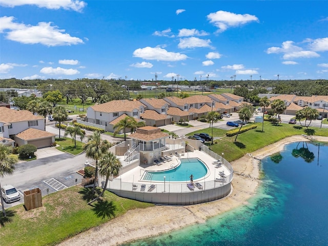 6400 46th Ave N Unit 61, Kenneth City, FL 33709 - aerial view of residential area featuring a pool and a large body of water
