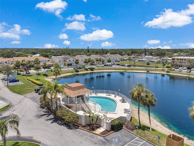 6400 46th Ave N Unit 61, Kenneth City, FL 33709 - aerial perspective of suburban area with a pool and a nearby body of water