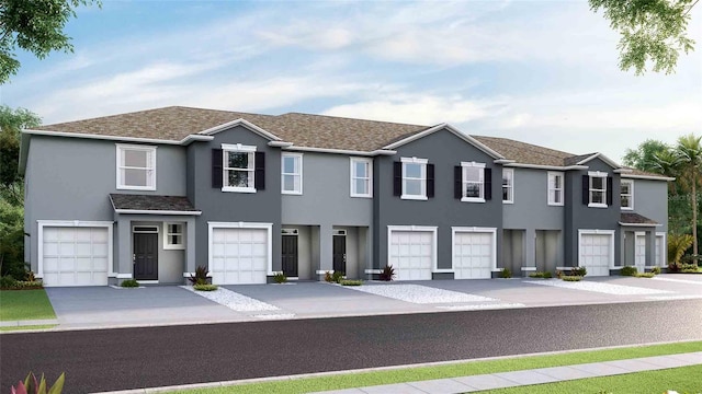 135 Mangrove Shade Cir, Apollo Beach, FL 33572 - townhome / multi-family property featuring stucco siding, an attached garage, driveway, and roof with shingles