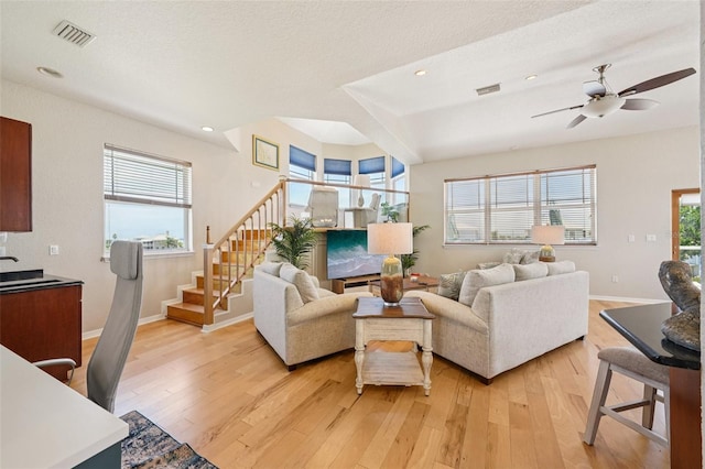 6543 Louise Ct, Hudson, FL 34667 - living room featuring stairs, light wood-style flooring, ceiling fan, and recessed lighting