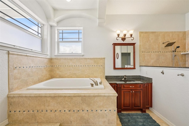 6543 Louise Ct, Hudson, FL 34667 - bathroom featuring vanity, a garden tub, tile patterned flooring, and tiled shower