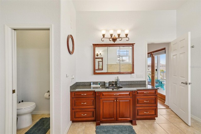 6543 Louise Ct, Hudson, FL 34667 - bathroom with vanity, tile patterned floors, and a chandelier