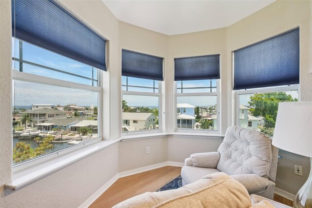 6543 Louise Ct, Hudson, FL 34667 - living area with wood finished floors and a water view