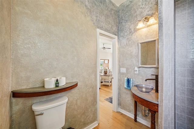 6543 Louise Ct, Hudson, FL 34667 - bathroom featuring wood finished floors and ceiling fan