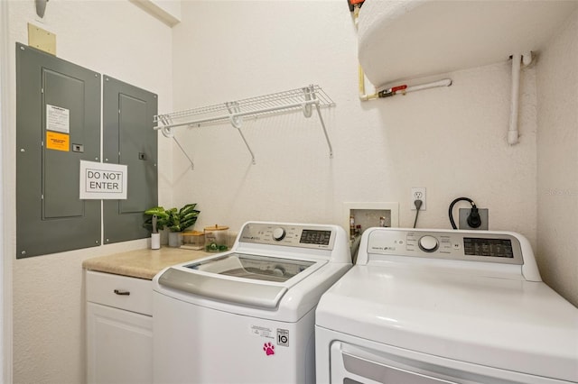 6543 Louise Ct, Hudson, FL 34667 - laundry room featuring cabinet space, separate washer and dryer, and electric panel