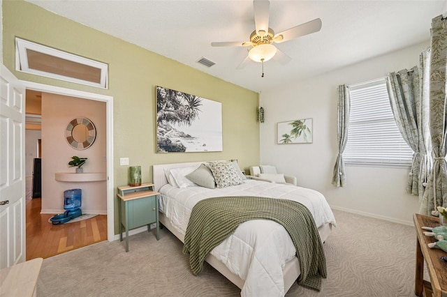 6543 Louise Ct, Hudson, FL 34667 - bedroom with light colored carpet and a ceiling fan