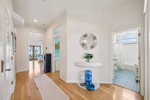 6543 Louise Ct, Hudson, FL 34667 - entryway with light wood finished floors, a towering ceiling, and recessed lighting