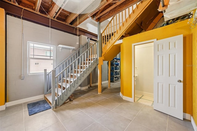 6543 Louise Ct, Hudson, FL 34667 - stairway featuring tile patterned floors and baseboards