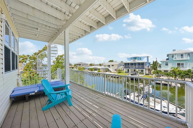 6543 Louise Ct, Hudson, FL 34667 - wooden deck with a water view and a residential view