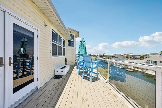 6543 Louise Ct, Hudson, FL 34667 - wooden terrace with a water view