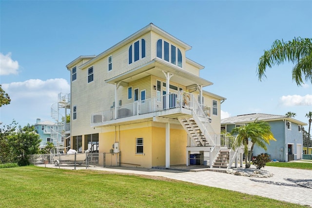 6543 Louise Ct, Hudson, FL 34667 - back of property featuring stairs, a patio, and stucco siding