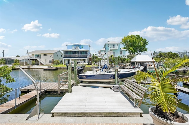6543 Louise Ct, Hudson, FL 34667 - dock area with a water view, a residential view, and boat lift