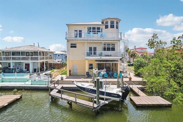 6543 Louise Ct, Hudson, FL 34667 - dock with a balcony, a patio area, and a water view