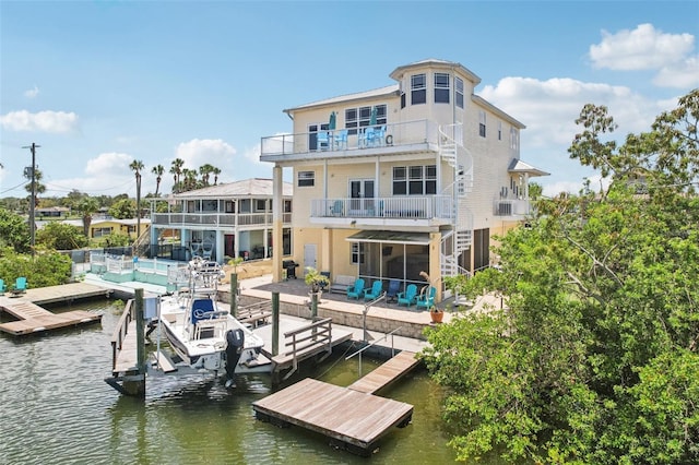 6543 Louise Ct, Hudson, FL 34667 - back of property featuring a balcony, stairway, a water view, a patio, and boat lift