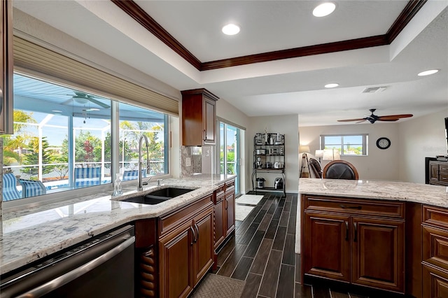 9619 Towanda Ln, Port Richey, FL 34668 - kitchen featuring dishwasher, a ceiling fan, ornamental molding, a tray ceiling, and plenty of natural light
