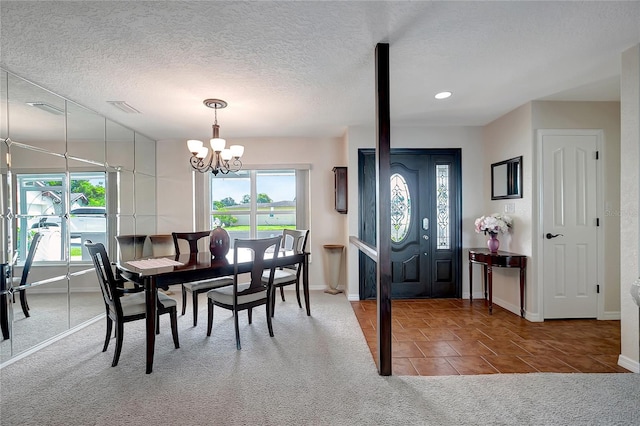 9619 Towanda Ln, Port Richey, FL 34668 - tiled dining area featuring carpet flooring, healthy amount of natural light, a chandelier, recessed lighting, and a textured ceiling