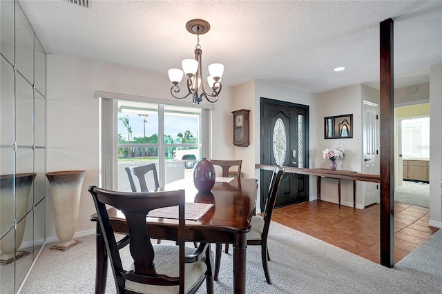9619 Towanda Ln, Port Richey, FL 34668 - dining room featuring healthy amount of natural light, a chandelier, a textured ceiling, light tile patterned floors, and recessed lighting