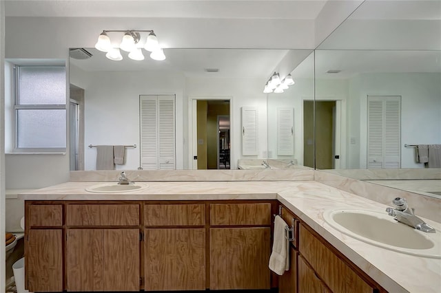 9619 Towanda Ln, Port Richey, FL 34668 - bathroom featuring a closet and double vanity
