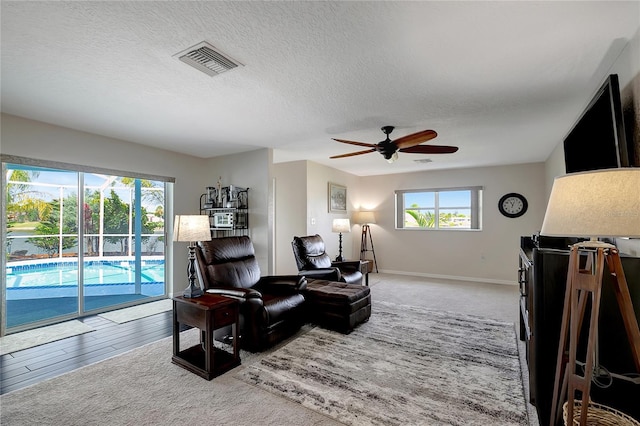 9619 Towanda Ln, Port Richey, FL 34668 - living area featuring ceiling fan and a textured ceiling