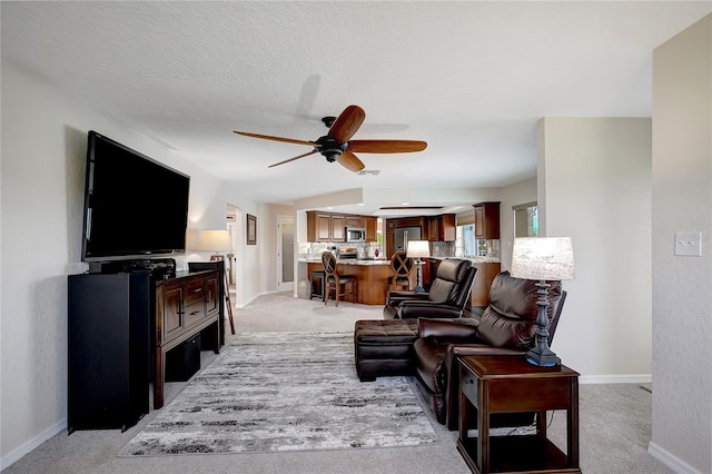 9619 Towanda Ln, Port Richey, FL 34668 - living area with a ceiling fan and light carpet