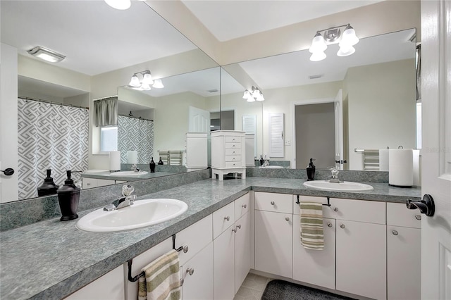 9619 Towanda Ln, Port Richey, FL 34668 - bathroom featuring double vanity and tile patterned floors