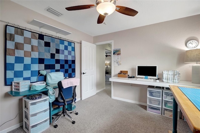 9619 Towanda Ln, Port Richey, FL 34668 - carpeted home office with a ceiling fan and baseboards
