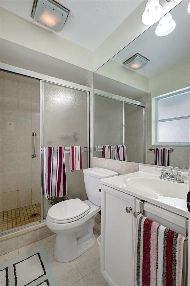 9619 Towanda Ln, Port Richey, FL 34668 - bathroom with vanity, tile patterned floors, and a stall shower