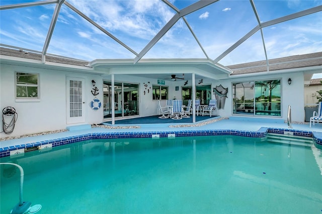 9619 Towanda Ln, Port Richey, FL 34668 - swimming pool with a patio area, ceiling fan, and a lanai