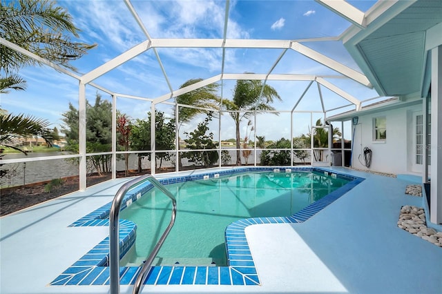 9619 Towanda Ln, Port Richey, FL 34668 - swimming pool featuring a patio area and glass enclosure