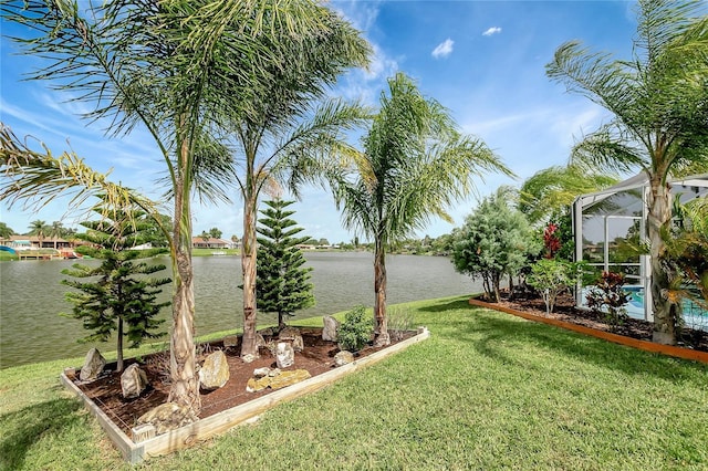 9619 Towanda Ln, Port Richey, FL 34668 - view of grassy yard featuring a water view, a swimming pool, and a lanai