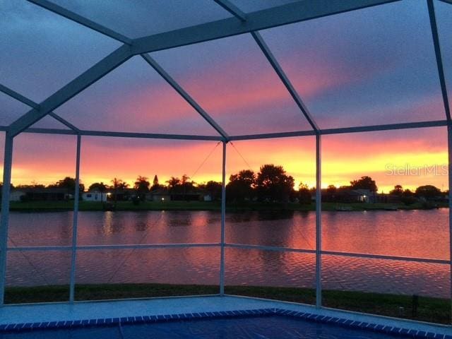 9619 Towanda Ln, Port Richey, FL 34668 - outdoor pool with a water view and glass enclosure