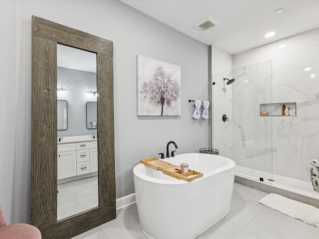 1340 Bayshore Blvd Unit 502, Dunedin, FL 34698 - full bathroom with a freestanding bath, a marble finish shower, vanity, and tile patterned flooring