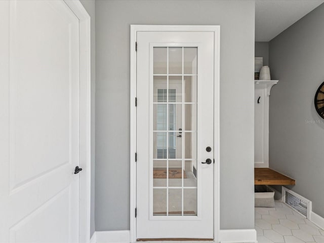 1340 Bayshore Blvd Unit 502, Dunedin, FL 34698 - mudroom with baseboards and tile patterned floors